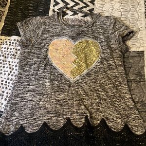 I am selling this girly shirt with the sequins heart